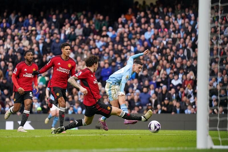 Manchester City's Phil Foden scores their second goal. PA 
