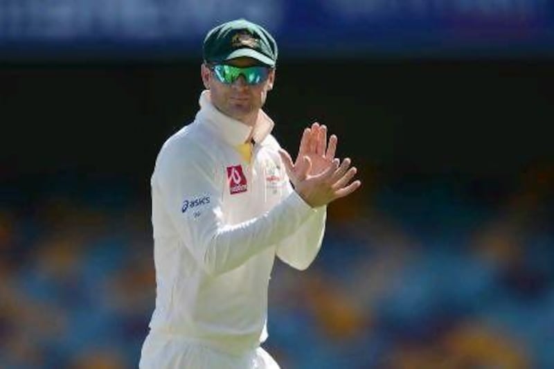 Michael Clarke, left, the Australia captain, said the umpires were right to make extra sure their decisions were accurate in Brisbane. Dave Hunt / EPA