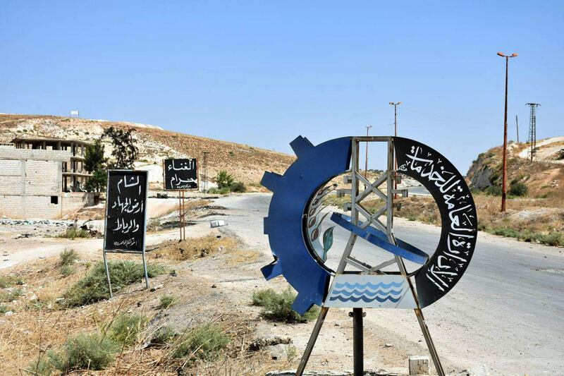 A sign erected by the Islamic State group is seen in Khan Sheikhun.