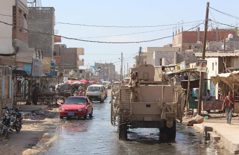 Pro-government forces patrol a street in Hawta, the capital of southern Lahj province which they retook from Al Qaeda, on April 24, 2016, as other loyalist fighters backed by the Saudi-led coalition launched an assault to retake the southern port city of Mukalla in Hadramawt province. Saleh Al Obeidi / AFP