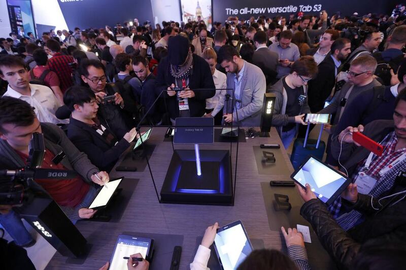 Participants check new Samsung Tab S3 devices during a pre-opening event at Mobile World Congress. Eric Gaillard / Reuters