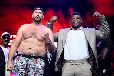 Tyson Fury and Francis Ngannou face off during a press conference in London. Getty