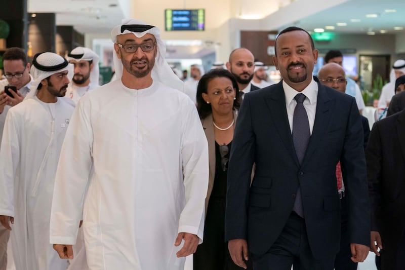 ABU DHABI, UNITED ARAB EMIRATES - March 18, 2019: HH Sheikh Mohamed bin Zayed Al Nahyan, Crown Prince of Abu Dhabi and Deputy Supreme Commander of the UAE Armed Forces (L) and HE Abiy Ahmed, Prime Minister of Ethiopia (R), tour the Special Olympics World Games Abu Dhabi 2019, at Abu Dhabi National Exhibition Centre (ADNEC). Seen with HH Sheikh Khalifa bin Tahnoon bin Mohamed Al Nahyan, Director of the Martyrs' Families' Affairs Office of the Abu Dhabi Crown Prince Court (back L).

( Ryan Carter / Ministry of Presidential Affairs )?
---