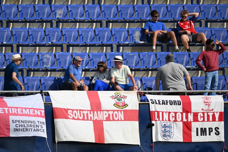 England fans place their flags in the stands. AFP