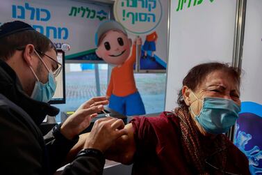 A health worker administers a dose of the Pfizer-BioNTech Covid-19 vaccine at Clalit Health Services in Jerusalem, on January 24, 2021. AFP
