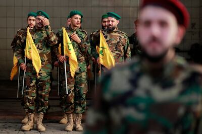 Lebanese Hezbollah fighters get ready to march in the funeral of a fellow militant, killed a day earlier in southern Lebanon during cross-border fire with Israeli troops, on Saturday. AFP