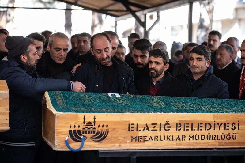 A relative grieves during a funeral ceremony of 5 members of the Aslan family in Elazig, Turkey. Getty Images