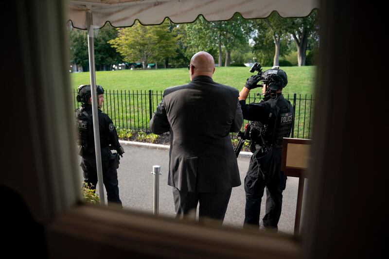 Members of the US Secret Service stand outside the James Brady Press Briefing Room at the White House. AP Photo