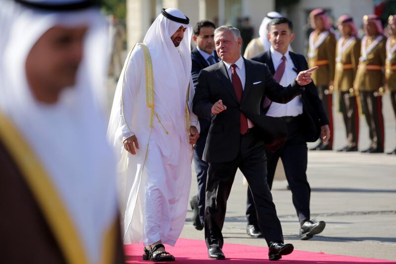 Sheikh Mohamed bin Zayed is welcomed by King Abdullah II at Queen Alia Airport in Amman, Jordan. Andre Pain / EPA