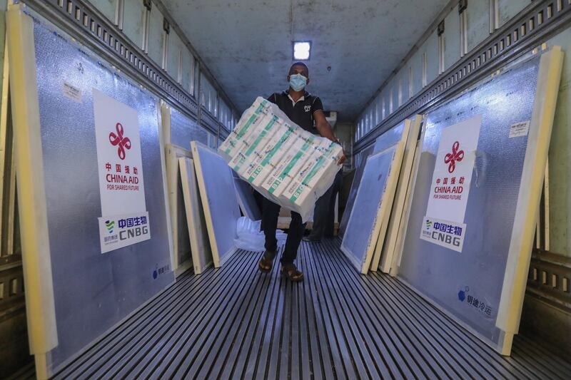 Sri Lankan health workers unload a newly arrived shipment of the Sinopharm Covid-19 vaccine donated by the Chinese government at the Medical Supplies Division in Colombo, Sri Lanka. EPA