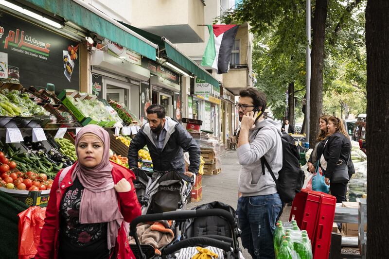 People on a Berlin street which is home to many Syrians and known for its Arab food. Bloomberg