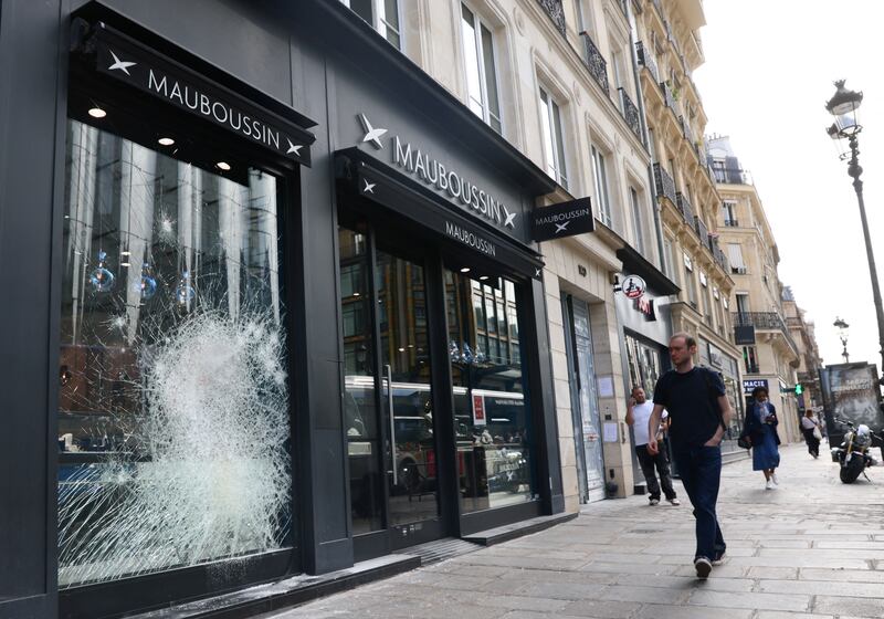 Damaged windows at the Mauboussin store at Rue de Rivoli in Paris. Reuters
