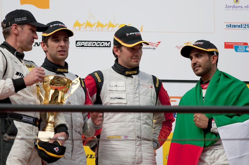 Dubai, United Arab Emirates, Jan 12 2013, 24h Dunlop - Team Abu Dhabi Black Falcon 1 Drivers stand on the awards podium before receiving their trophies, (right to left) Al Qubaisi , Edwards, Bleekemolen and Schneider,   this will be their second win for Team Abu Dhabi .  Mike Young / The National?