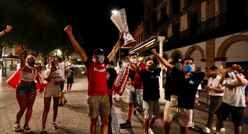 Sevilla supporters celebrate in Spain. EPA