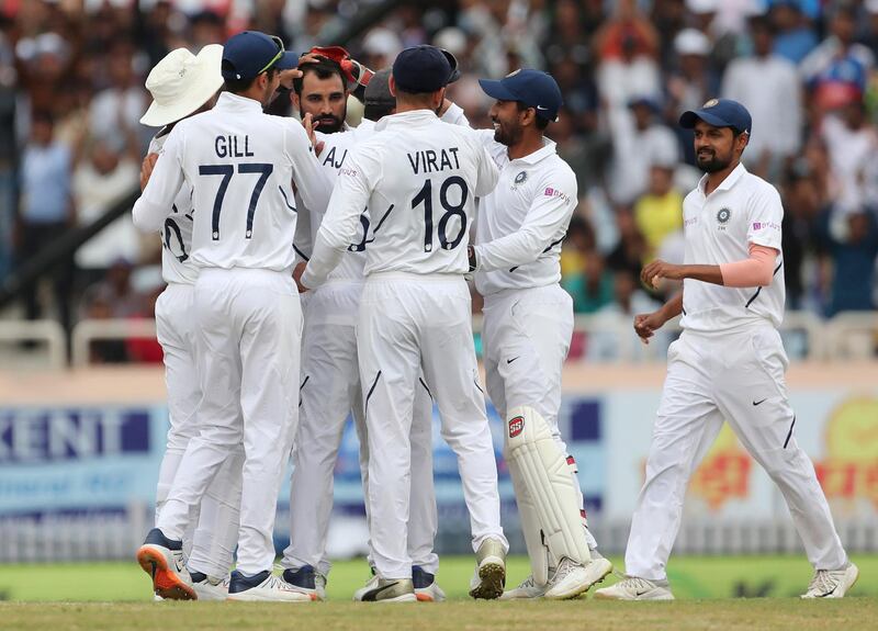 India's Mohammed Sham celebrates with teammates the dismissal of Dean Elgar. AP