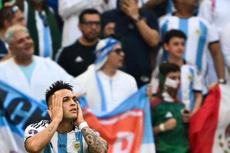 Argentina forward Lautaro Martinez has his head in his hands after he scored a World Cup goal against Saudi Arabia which was later disallowed following a VAR review. AFP
