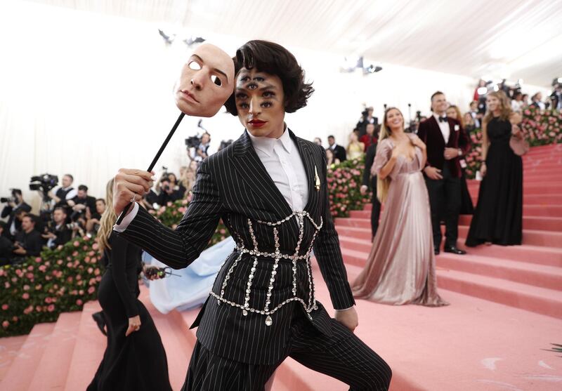 Actor Ezra Miller arrived on the red carpet wearing a jeweled corset and surrealist make up. EPA