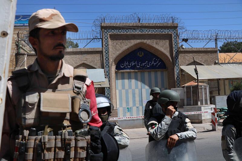epa08415049 Afghan riot police stand guard outside the Iranian consulate during a protest against the Iranian regime and demand justice for the Afghans allegedly killed by the Iranian security forces, in Herat, Afghanistan, on May 11, 2020. EPA