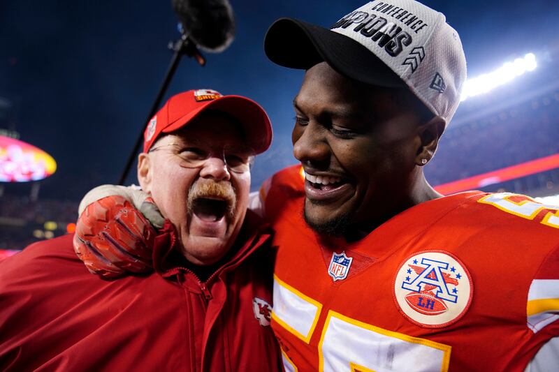 Kansas City Chiefs head coach Andy Reid celebrates with defensive end Frank Clark. AP Photo