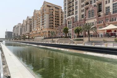 Dubai Sports City residents say stagnant water in under-construction canal, which runs through the community, is creating a build up of mosquitoes and flies on residential balconies. Antonie Robertson / The National