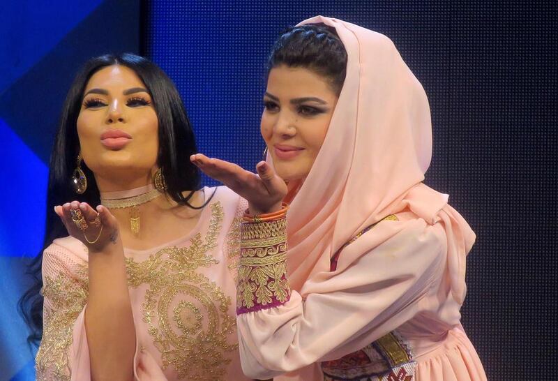  Aryana Sayeed, left, a judge of the television music competition Afghan Star, poses with competitor Zulala Hashemi in Kabul on March 9, 2017.  Anne Chain / AFP 