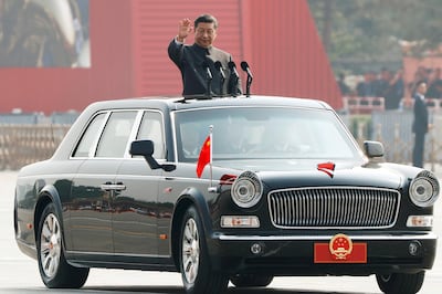 Chinese President Xi Jinping waves from a vehicle as he reviews the troops at a military parade marking the 70th founding anniversary of People's Republic of China, on its National Day in Beijing, China October 1, 2019.  REUTERS/Thomas Peter     TPX IMAGES OF THE DAY