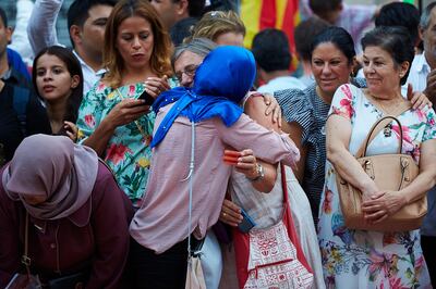 epa06155303 Two women embraces each other during a demonstration organized by several Muslim association of Catalonia which gathered the main religious denominations of the community to express their rejection of any type of terrorism after the attacks in Catalonia, in Barcelona, Spain, 21 August 2017. Catalonian police Mossos d'Esquadra has shot down a man wearing what looked like an explosive belt, and believed to be the alleged attack van driver Younes Abouyaaqoub, during a police operation in Subirats, near Barcelona. At least 14 people have died and 130 were injured when two vehicles crashed into pedestrians in Las Ramblas, downtown Barcelona and on a promenade in Cambrils on 17 August.  EPA/ALEJANDRO GARCIA