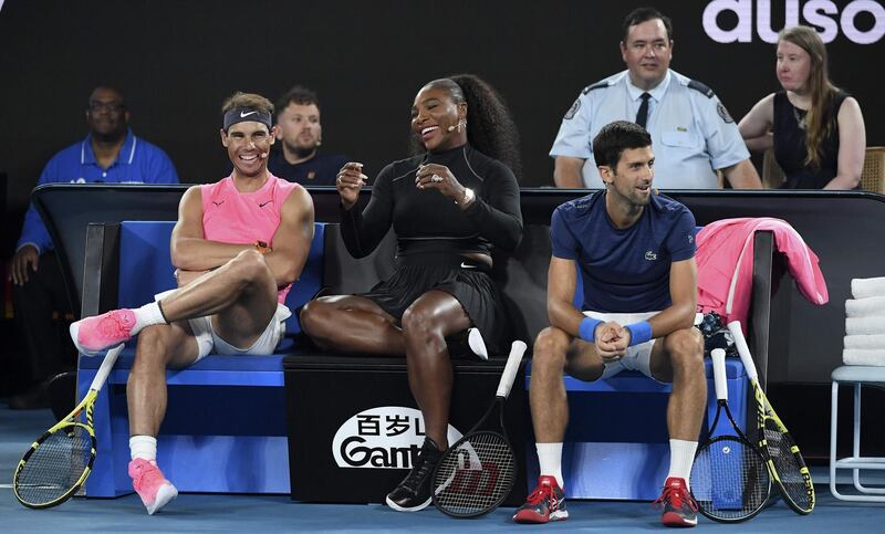 (FILES) In this file photo Serena Williams of the US (C) shares a lighter moment  with Rafael Nadal of Spain (L) and Novak Djokovic of Serbia (R) as they and other top players play in the Rally for Relief charity tennis match in support of the victims of the Australian bushfires, in Melbourne of January 15, 2020, ahead of the Australian Open tennis tournament. Top-ranked Novak Djokovic and world number two Rafael Nadal have entered the US Open tuneup tournament to be played in New York while Serena Williams is in the women's field. Organizers of the ATP and WTA Western and Southern Open, typically played in Cincinnati but moved to New York this year due to the coronavirus pandemic, announced initial singles entry lists on July 29, 2020.
 - -- IMAGE RESTRICTED TO EDITORIAL USE - STRICTLY NO COMMERCIAL USE --
 / AFP / WILLIAM WEST / -- IMAGE RESTRICTED TO EDITORIAL USE - STRICTLY NO COMMERCIAL USE --
