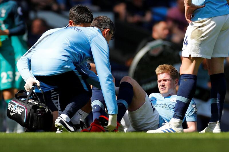 Manchester City's Kevin De Bruyne receives medical attention after sustaining an injury. Reuters