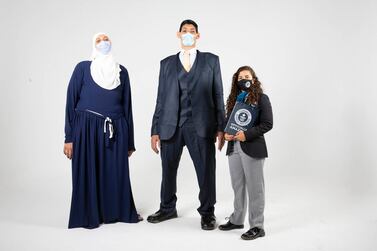 Egyptian siblings Mohamed and Huda Shehata at a Guinness World Records ceremony after breaking five records because of their gigantism. Guinness World Records Arabia