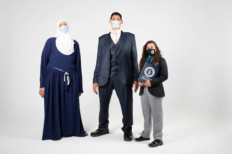 Egyptian siblings Mohamed and Huda Shehata at a Guinness world records press ceremony after breaking five records because of their gigantism. Cairo, Egypt. Photo: Guinness World Records Arabia