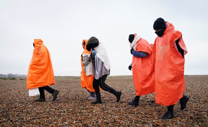 A group of people thought to be migrants are brought in to Dungeness, Kent, after being rescued by the RNLI from a boat in the English Channel. Getty Images