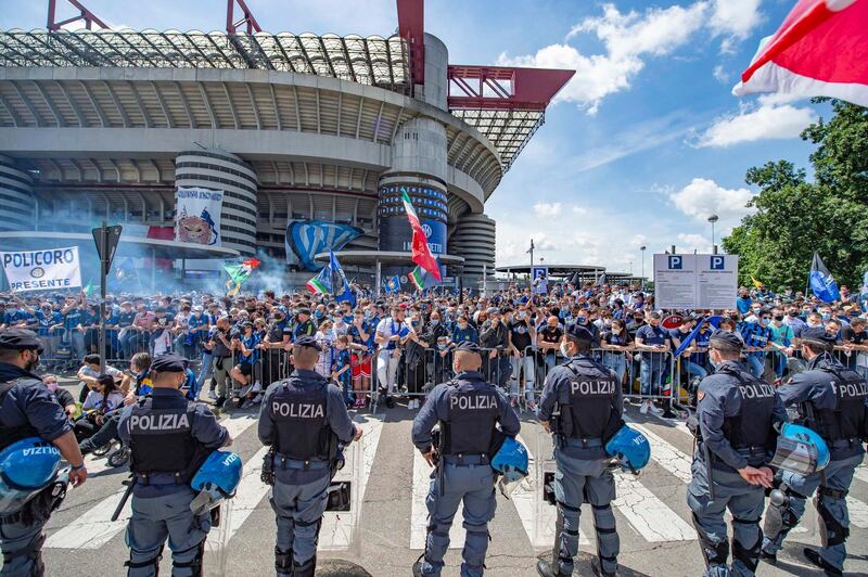 Inter supporters celebrate outside the San Siro before the match. EPA