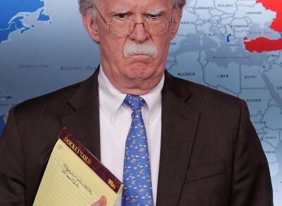 U.S. National Security Adviser John Bolton holds a pad of note paper with a note reading "5,000 troops to Colombia" as he waits to address reporters as the Trump administration announces economic sanctions against Venezuela and the Venezuelan state owned oil company Petroleos de Venezuela (PdVSA) during a press briefing at the White House in Washington, U.S., January 28, 2019. REUTERS/Jim Young