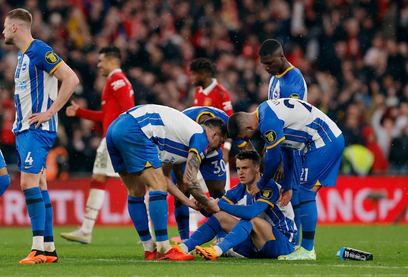 Brighton & Hove Albion's Solly March, Moises Caicedo, Deniz Undav and Lewis Dunk after losing the penalty shootout. Reuters 