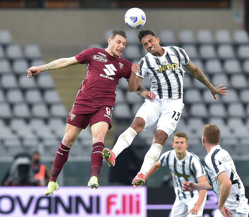 Torino's Andrea Belotti and Juventus' Danilo in action. EPA