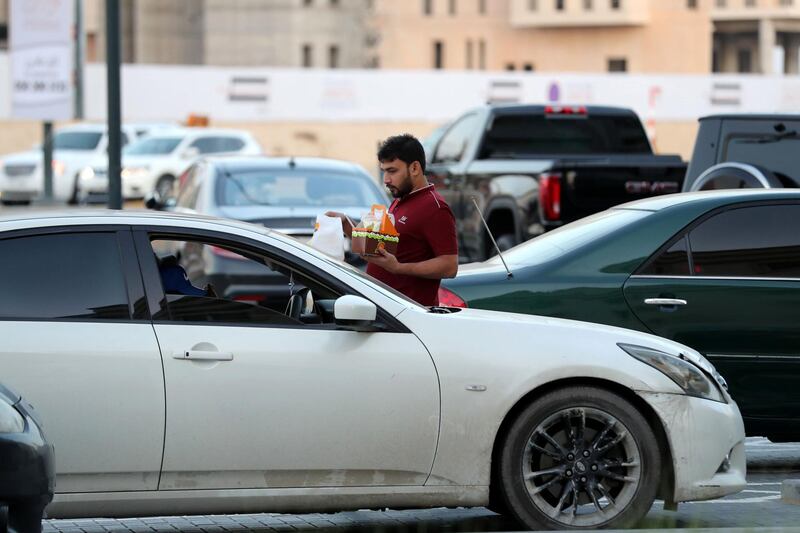 Sharjah, United Arab Emirates - November 27th, 2019: National Day feature on Rounding where people drink tea in their cars. Wednesday, November 27th, 2019, Sharjah. Chris Whiteoak / The National