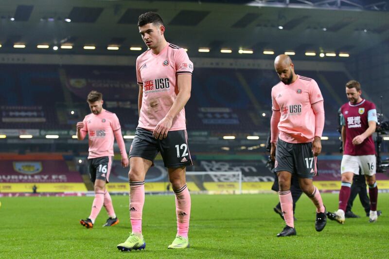 BURNLEY, ENGLAND - DECEMBER 29: John Egan and David McGoldrick of Sheffield United look dejected after the Premier League match between Burnley and Sheffield United at Turf Moor on December 29, 2020 in Burnley, England. The match will be played without fans, behind closed doors as a Covid-19 precaution. (Photo by Alex Livesey/Getty Images)