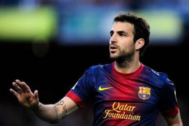 New coach Gerardo Martino wants to stop all the talk of Cesc Fabregas, above, leaving Barcelona. David Ramos / Getty Images