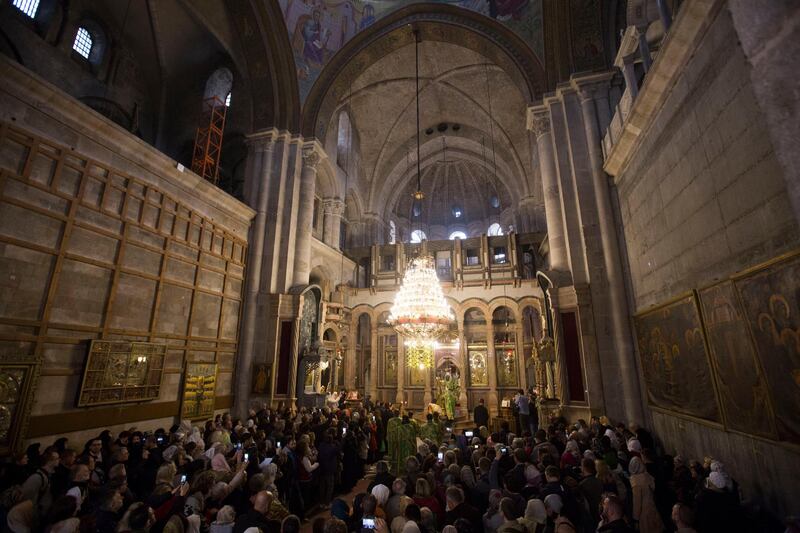 Greek Orthodox Patriarch of the Holy Land Theofilos III, leads the Orthodox Palm Sunday mass at the Church of the Holy Sepulchre, traditionally believed to be the burial site of Jesus Christ, in Jerusalem's Old City.  AP