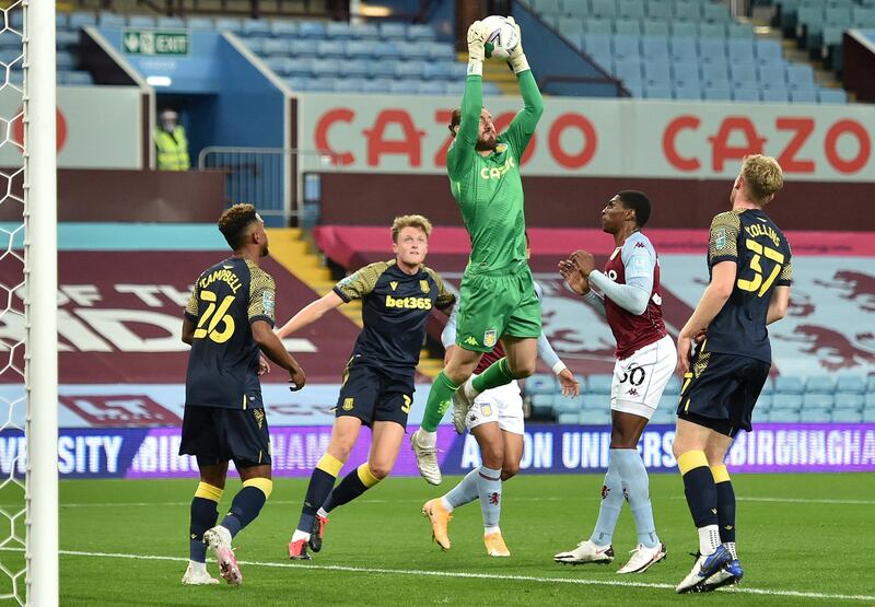 Aston Villa's English goalkeeper Jed Steer (C) jumps to catch the ball during the English League Cup fourth round football match between Aston Villa and Stoke at Villa Park in Birmingham, central England on October 1, 2020. (Photo by PETER POWELL / POOL / AFP) / RESTRICTED TO EDITORIAL USE. No use with unauthorized audio, video, data, fixture lists, club/league logos or 'live' services. Online in-match use limited to 120 images. An additional 40 images may be used in extra time. No video emulation. Social media in-match use limited to 120 images. An additional 40 images may be used in extra time. No use in betting publications, games or single club/league/player publications. / 