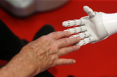 Robot Pepper meets an elderly woman in Geneva in July. Getty Images