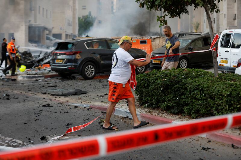Security tape is rolled out in the streets after rockets launched from the Gaza Strip hit Israel. Reuters