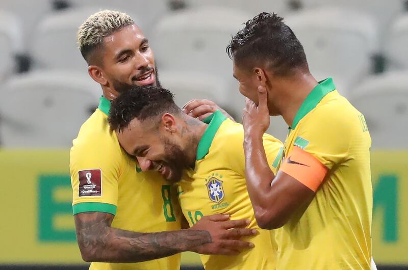 Neymar  celebrates with teammates Douglas Luiz and Thiago Silva. AFP