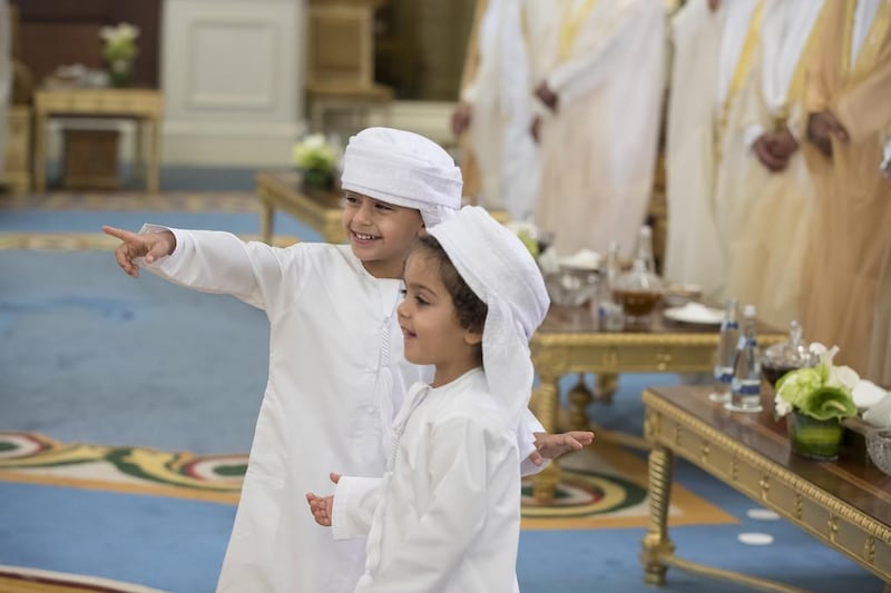 Sheikh Mohammed bin Nahyan bin Saif Al Nahyan, left, and Sheikh Saif bin Nahyan bin Saif Al Nahyan attend an Eid Al Fitr reception. Mohamed Al Hammadi / Crown Prince Court - Abu Dhabi