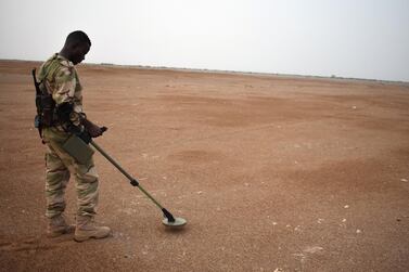 A Sudanese soldier, stationed in Yemen as part of the Arab Coalition, checks for mines in a exercise near Al Mokha, eastern Yemen. Gareth Browne/The National