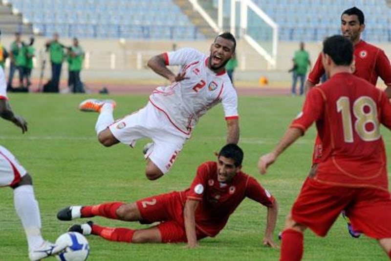 The UAE's Khalid Sabeel, top, visibly wincing following a heavy challenge from a Lebanon defender. Bruno Metsu, the former Emirates coach, had said when leaving his post in 2008 that national players are 'not physically strong' and hinted they lack fighting spirit when they are behind in matches. Wael Hamzeh / EPA