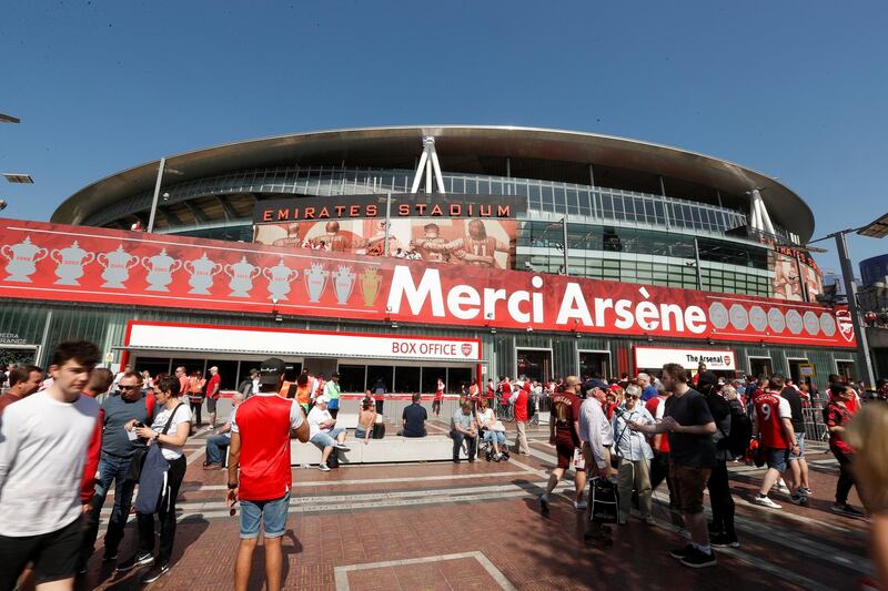 Soccer Football - Premier League - Arsenal vs Burnley - Emirates Stadium, London, Britain - May 6, 2018  General view fans and a banner in reference to Arsenal manager Arsene Wenger outside the stadium before the match   Action Images via Reuters/Matthew Childs  EDITORIAL USE ONLY. No use with unauthorized audio, video, data, fixture lists, club/league logos or "live" services. Online in-match use limited to 75 images, no video emulation. No use in betting, games or single club/league/player publications.  Please contact your account representative for further details.