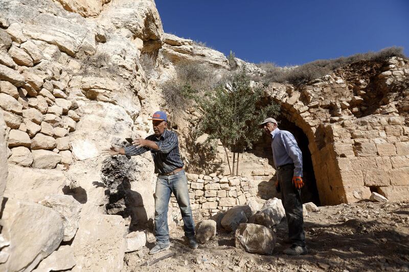Archaeologists work at a historical monastery site in Taffouh village near the West Bank City of Hebron. EPA