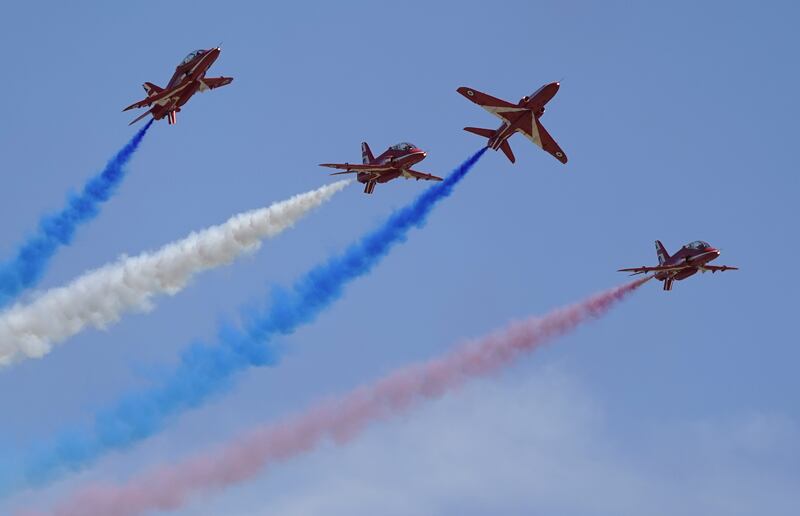 The Red Arrows team performs over RAF Odiham in Hampshire. PA